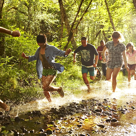 kids running through the forest